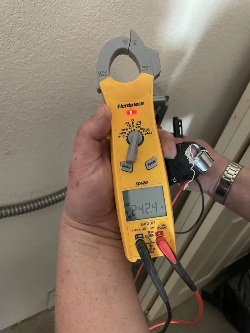 Voltage testing with clamp meter during Circuit Breaker Repair in Chatham